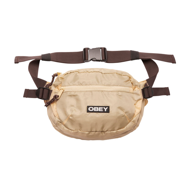 Bestel de Obey Commuter Waist Bag Tan multi snel, gemakkelijk en veilig bij Revert 95. Check onze website voor de gehele Obey collectie, of kom gezellig langs bij onze winkel in Haarlem.