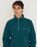 Obey Established Works Bold Mockneck Mediterranea, heavyweight mockneck sweater van 58% cotton 42% polyester met zichtbare metalen rits, welt zakken en rib knit afwerking, regular fit, verkrijgbaar bij Revert 95 Haarlem