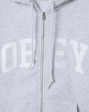 Obey Collegiate Zip Hood, 58% cotton 42% polyester heavyweight brushed fleece zip hoodie met exposed front metal zipper front patch pockets rib cuffs en hem tackle twill lettering op voorkant in relaxed fit verkrijgbaar in Ash Grey en Black, verkrijgbaar bij Revert 95 Haarlem