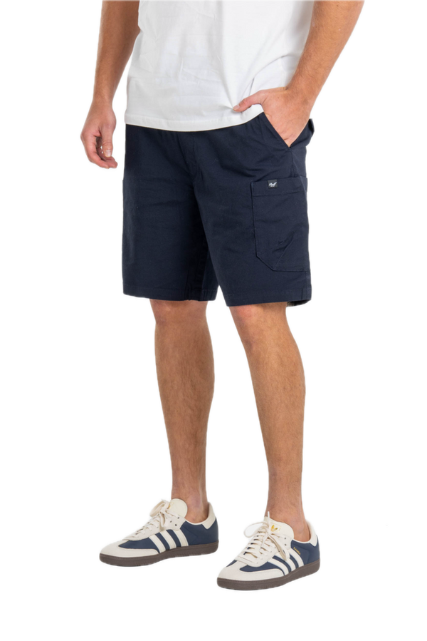 Reell Reflex Easy Cargo Short BR Midnight Indigo – comfortabele cargoshort met stretch, cargozakken en elastische tailleband in indigo blauw