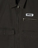 Obey Walter Work Jacket in Black Faded Wash, 100% cotton canvas relaxed fit work jacket met front metal zipper besom chest pocket patch pockets met hidden snap adjustable cuffs adjustable back waist tab fully lined en Obey patch op de borst, verkrijgbaar bij Revert 95 Haarlem