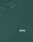 Obey Lowercase Pigment T-Shirt in Pigment Pine Needle, 100% cotton pigment dyed short sleeve crew neck regular fit tee met Lowercase Obey embroidery op borst in diepe gedempte groene Pine Needle colorway, verkrijgbaar bij Revert 95 Haarlem
