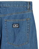 Obey Emerson Denim in Salty Blue Stone Wash, 100% cotton 10 oz denim loose fit jeans met shank button closure zipper fly klassiek 5-pocket design 18.5 inch leg opening en Obey labeling op achterzak in subtiel vintage gewassen lichtblauwe kleur, verkrijgbaar bij Revert 95 Haarlem