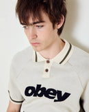Obey Sport Polo Sweater Unbleached Multi, polosweater van 100% viscose met gestreepte rib polokraag, contrastpanelen en relaxed fit, maten S-XXL, verkrijgbaar bij Revert 95 Haarlem