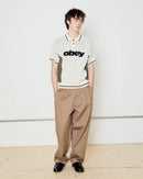 Obey Sport Polo Sweater Unbleached Multi, polosweater van 100% viscose met gestreepte rib polokraag, contrastpanelen en relaxed fit, maten S-XXL, verkrijgbaar bij Revert 95 Haarlem