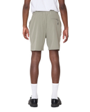 Obey Travel Short in Vetiver, 92% polyester 8% spandex 3.5 oz lichtgewicht short met elastic waistband rounded drawcord faux fly front slash pockets zipper closure back welt pocket reflective Obey logo op been relaxed fit 7 inch inseam in gedempte olijfgroene Vetiver colorway, verkrijgbaar bij Revert 95 Haarlem