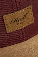 Reell Suede Cap, 80% cotton 20% suede 6-panel ball cap geïnspireerd op jaren 50 stijlen met flat suede rand aan klep kleur-geblokeerd design embossed Reell Script Logo Patch op voorkant en script logo flag snapback closure one size fits most, verkrijgbaar bij Revert 95 Haarlem