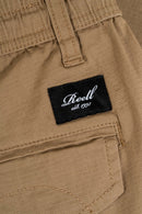 Reell Reflex Easy Cargo Short BR in Dark Sand, lichtgewicht Baby Ripstop cargo short met geritste zijzakken en welted zakken in warme beige zandkleur, verkrijgbaar bij Revert 95 Haarlem.
