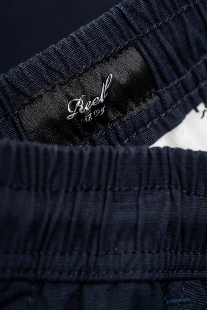Reell Reflex Easy Cargo Short BR Midnight Indigo – comfortabele cargoshort met stretch, cargozakken en elastische tailleband in indigo blauw