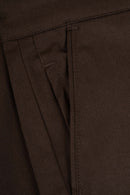 Reell Loose Flex Chino PC broek in Chocolate Brown, loose fit chino van dubbel geverfd polycotton met chino-details en subtiele Reell branding, verkrijgbaar bij Revert 95 Haarlem