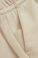 Reell Surface Short in Waffle colorways, 58% polyester 39% katoen 3% elastaan waffle stof short met elastische drawstring taille achterzakken en minimalistisch Reell branding label verkrijgbaar in Waffle Oatmeal, Waffle Chinois Green en Waffle Black, verkrijgbaar bij Revert 95 Haarlem