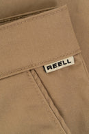 Reell Loose Flex Chino PC broek in Chocolate Brown, loose fit chino van dubbel geverfd polycotton met chino-details en subtiele Reell branding, verkrijgbaar bij Revert 95 Haarlem
