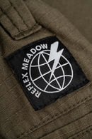 Reell Reflex Meadow broek in Flat White Ripstop, oversized chino-geïnspireerde broek van lichtgewicht ripstop met laag kruis en elastische tailleband, verkrijgbaar bij Revert 95 Haarlem