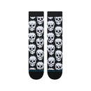 Stance Static Skull Crew Socks Black, crew sokken met all-over digitaal glitch-schedelpatroon en cyaanblauwe accentlijn, verkrijgbaar bij Revert 95 Haarlem