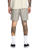 RVCA Exotica Seersucker Elastic 17 inch Short in Light Khaki Stripes, polyester seersucker short met elasticated waist adjustable drawcord schuine frontpockets grote mesh side pockets back pocket met flap en button closure drain eyelet en Exotica label op linkerbeen in gedempte kaki stripe colorway, verkrijgbaar bij Revert 95 Haarlem