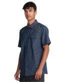 RVCA Rosa Chambray Shirt in Indigo, lichtgewicht 100% katoenen chambray overhemdje met Rosa botanische print regular fit en kort mouw button-up sluiting, verkrijgbaar bij Revert 95 Haarlem