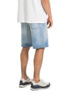 Reell Bolt Short in Light Blue Wash, loose regular fit denimshort van biologisch en gerecycled katoen met five-pocket constructie en vegan leren backpatch, verkrijgbaar bij Revert 95 Haarlem