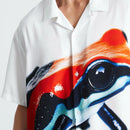 HUF Darien Resort Shirt in Multi, 100% rayon 150G camp collar short sleeve resort shirt met engineered HUF frog artwork op voorpanelen in witte basis met kleurrijke frog colors button-down front branded buttons side vent slits relaxed fit, verkrijgbaar bij Revert 95 Haarlem