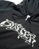 Butter Goods Drummer Zip-Thru Hoodie in Washed Black, heavyweight cotton fleece garment wash full zip-through hoodie met Drummer branding op de voorkant relaxed fit front pockets en ribbed trims, verkrijgbaar bij Revert 95 Haarlem