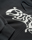 Butter Goods Drummer Zip-Thru Hoodie in Washed Black, heavyweight cotton fleece garment wash full zip-through hoodie met Drummer branding op de voorkant relaxed fit front pockets en ribbed trims, verkrijgbaar bij Revert 95 Haarlem