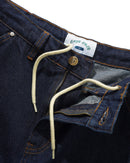Cash Only Point Denim Shorts in Raw Denim met carpenter pocket detail, self fabric hammer loop en messing logo knoop, verkrijgbaar bij Revert 95 Haarlem