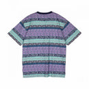 Santa Cruz Heights T-Shirt in Winkowski Vertigo, 100% cotton 180gsm jersey loose fit tee met custom all over psychedelische Winkowski Vertigo print in paars turquoise en blauw te combineren als matching set met de Heights Swimshorts, verkrijgbaar bij Revert 95 Haarlem
