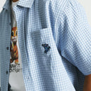 HUF Stuck On You Short Sleeve Plaid Shirt in Ice Blue, poly cotton viscose blend 130G relaxed fit plaid shirt met yarn-dyed textured plaid embroidered artwork op linker borstzak button-down front engraved buttons en HUF woven label in frisse lichtblauwe Ice Blue colorway, verkrijgbaar bij Revert 95 Haarlem