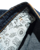 Butter Goods Santosuosso Denim Jeans in Streaky Navy, 100% cotton denim ultra baggy tapered fit met contrasting stitching geborduurd Philly coin stash pocket PU belt patch en flag label branding, verkrijgbaar bij Revert 95 Haarlem