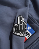 Cash Only Service Zip Thru Hood in Washed Navy met mineral wash behandeling, geborduurde patches all over en volledige ritsluiting, verkrijgbaar bij Revert 95 Haarlem