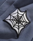 Cash Only Service Zip Thru Hood in Washed Navy met mineral wash behandeling, geborduurde patches all over en volledige ritsluiting, verkrijgbaar bij Revert 95 Haarlem