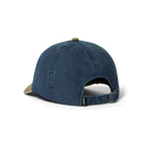 HUF Two Tone 89 Washed 6 Panel Hat in Navy met navy crown, contrasterende tan klep en geborduurd artwork op de front crown, verkrijgbaar bij Revert 95 Haarlem