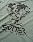 Butter Goods Terrain T-Shirt in Dull Mint, 100% katoen 230gsm regular fit met ribbed collar en vintage-style All Terrain Equipment screen print op voor- en achterkant in gedempte mintgroene kleur, verkrijgbaar bij Revert 95 Haarlem