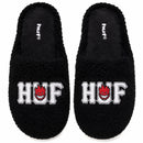 HUF Fuzzy Slipper Black, fuzzy-gevoerde slipper van 100% polyester met Green Buddy artwork en cupsole, verkrijgbaar bij Revert 95 Haarlem